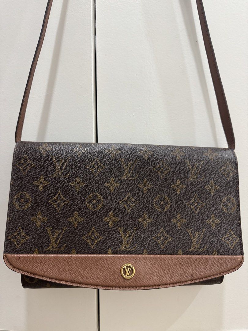 Louis Vuitton Monogram Crossbody Bag Brown (Category: Luxury Bags & Wallets) located in Muntinlupa City. Submitted by lrio.emlyrse (Listing ID 1466844851, Image 2). Description: - Brand: Louis Vuitton - Style: Classic vintage crossbody bag - Material: Monogram canvas with brown leather trim - Hardware: Gold-tone clasp closure - Interior: Brown cross-grain leather lining with a zippered pocket - Condition: Clean interior and exterior, well-maintai