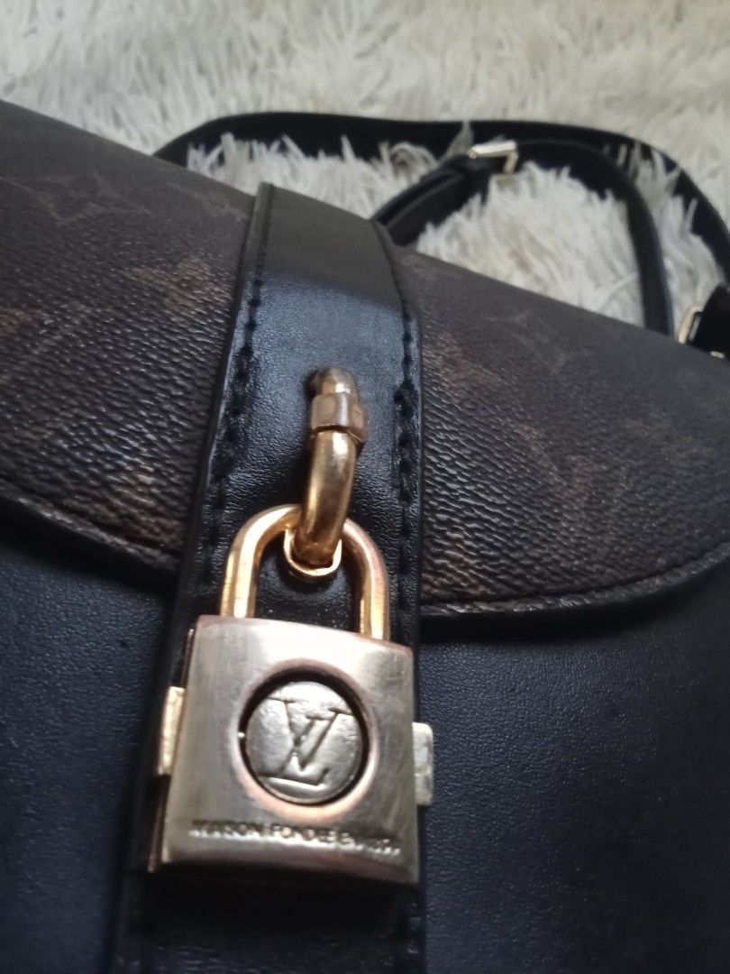 Louis Vuitton Monogram Eclipse Metis Saddle Bag (Category: Luxury Bags & Wallets) located in Caloocan City. Submitted by noy5o1a (Listing ID 1466802087, Image 3). Description: - Louis Vuitton saddle bag - Monogram canvas paired with durable black leather - Front strap closure accented with a gold-tone padlock - Includes an adjustable black shoulder strap for comfortable wear - Black interior lining featuring a convenient slip pocket - Perfect lux