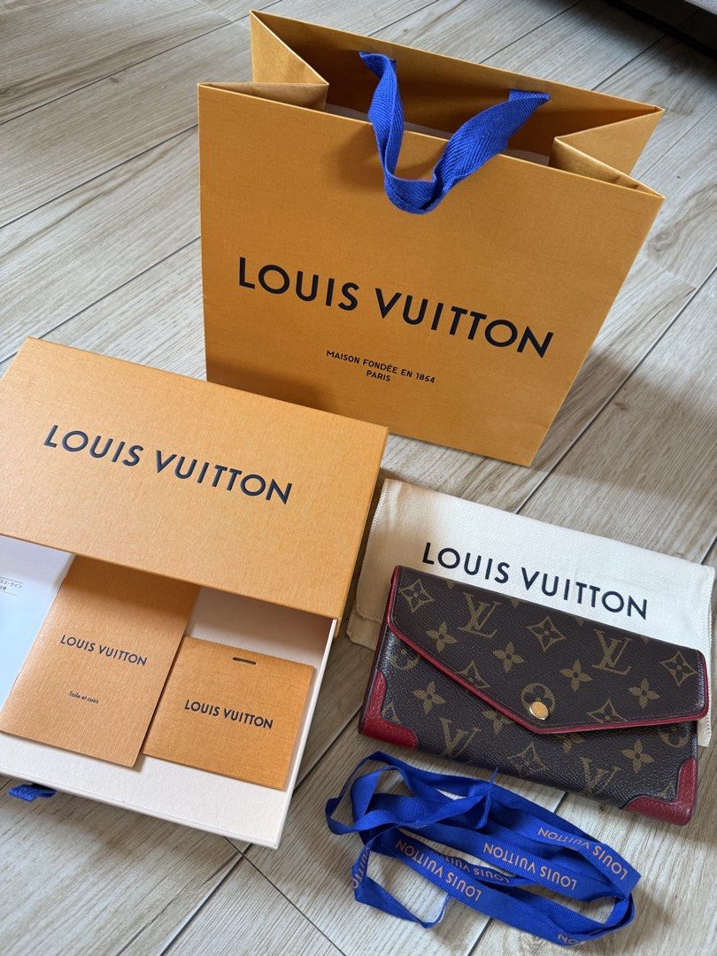 Louis Vuitton Monogram Sarah Retiro Cherry (Category: Luxury Bags & Wallets) located in Manila. Submitted by mariadarna (Listing ID 1466866533, Image 1). Description: Louis Vuitton Monogram Sarah Retiro Wallet in Cherry (Red), crafted from the brand’s signature monogram coated canvas with red leather trim, gold-tone hardware, and an envelope-style snap closure.