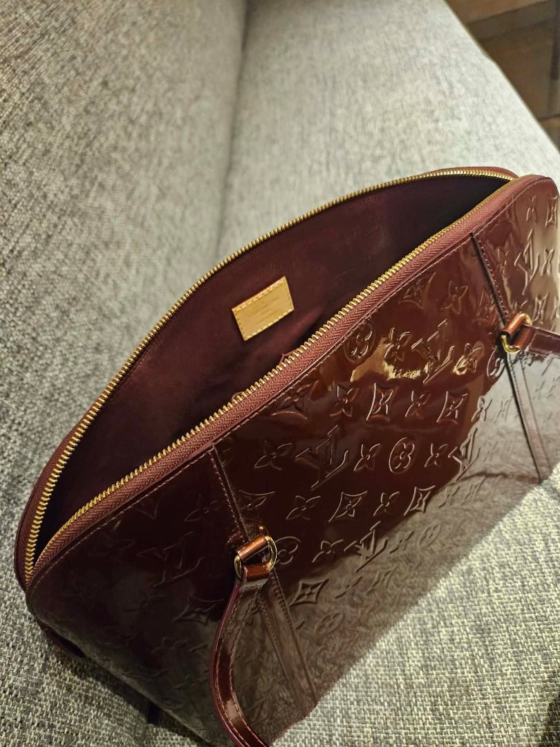 Louis Vuitton Monogram Vernis Handbag (Category: Luxury Bags & Wallets) located in Pasig City. Submitted by kim.es06 (Listing ID 1466776732, Image 2). Description: - Authentic Louis Vuitton Monogram Vernis shoulder bag - Rich dark brown glossy embossed patent leather - Elegant slim straps with gold-tone hardware - Secure top zipper closure - Fabric-lined interior with convenient slip pockets - Includes original Louis Vuitton Monogram Vernis bookl