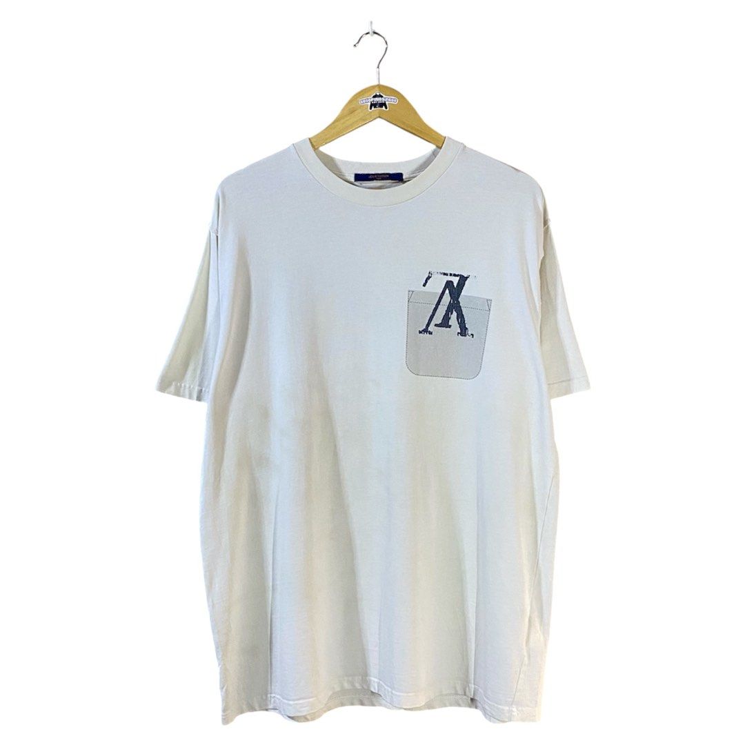 Louis Vuitton Printed Pocket Tee (Category: Luxury Apparel) located in Baguio. Submitted by goodfinds2600v2 (Listing ID 1466886580, Image 1). Description: Size on tag: L fits XL Dimensions: L-30.5 W/Bust-24 Description: unisex Condition: Good Issue/s: light stains, faded print .