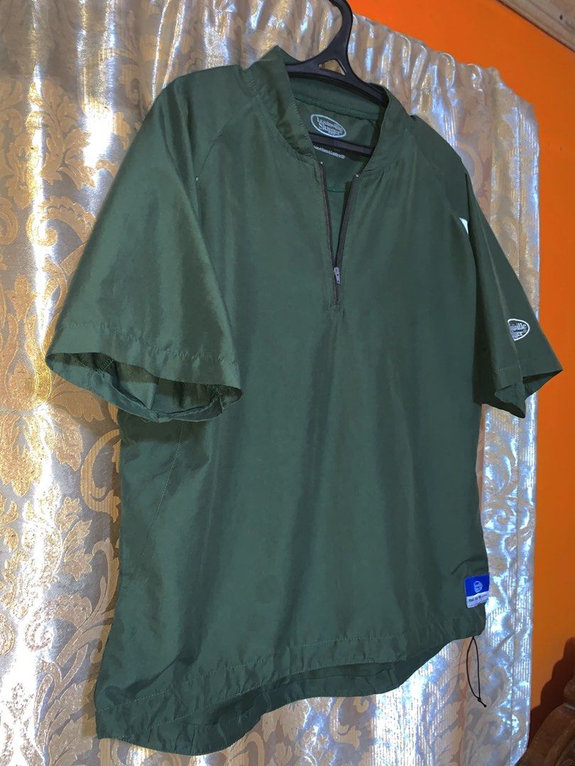 Louisville Slugger short-sleeve half-zip batting cage pullover jacket (Category: Tshirts & Polo Shirts ) located in Manila. Submitted by rmr_23 (Listing ID 1466829218, Image 2). Description: Size: -chest: 28 -length: 30 • Brand: Louisville Slugger • Design: Features a 1/4 zip front pull-over style with white athletic panels cut beneath the armpits and shoulders •Logos: Includes the classic Louisville Slugger oval logo embroidered on the left slee