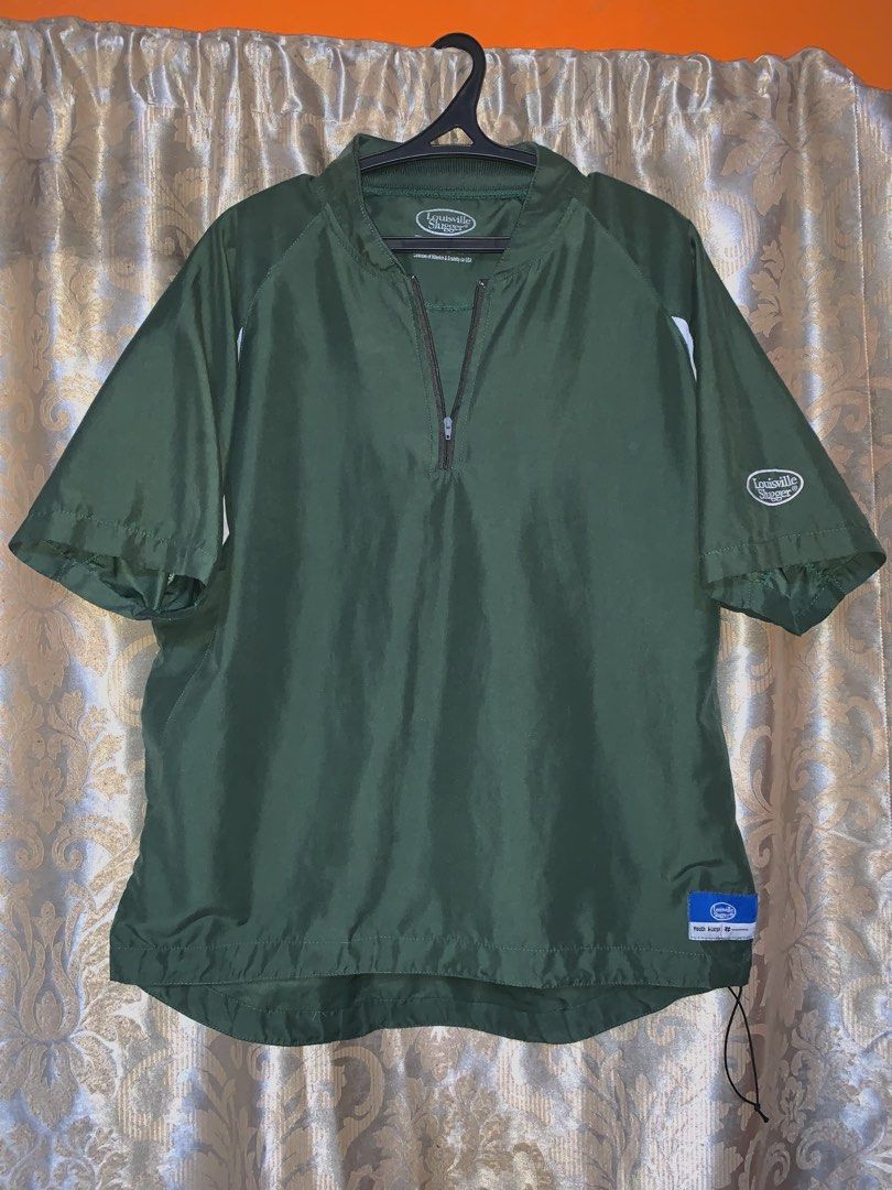 Louisville Slugger short-sleeve half-zip batting cage pullover jacket (Category: Tshirts & Polo Shirts ) located in Manila. Submitted by rmr_23 (Listing ID 1466829218, Image 1). Description: Size: -chest: 28 -length: 30 • Brand: Louisville Slugger • Design: Features a 1/4 zip front pull-over style with white athletic panels cut beneath the armpits and shoulders •Logos: Includes the classic Louisville Slugger oval logo embroidered on the left slee
