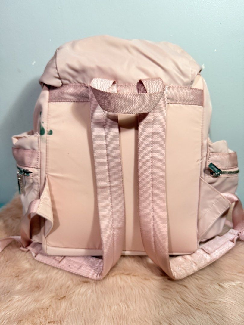 Lululemon City Adventurer Backpack Light Pink (Category: Backpacks) located in Quezon City. Submitted by shaberbree (Listing ID 1466910914, Image 3). Description: - Brand: Lululemon - Model: City Adventurer Backpack - Color: Light Pink - Closure: Drawstring with dual front metal buckles - Features: Padded shoulder straps, top handle, exterior side zip pockets, interior laptop sleeve, and zippered pocket - Condition: Clean overall and fully functi