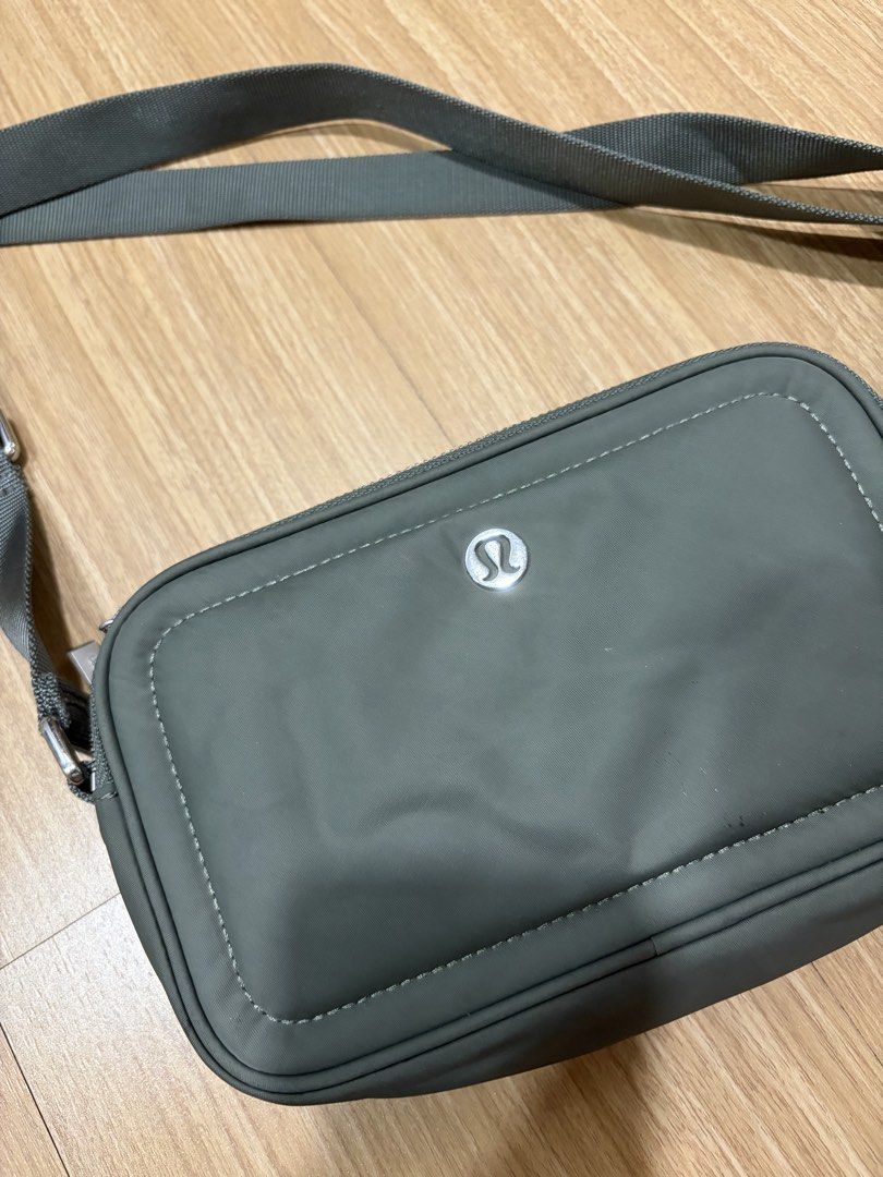 Lululemon Crossbody Camera Bag Sage Green (Category: Cross-body Bags) located in Makati City. Submitted by citysunset (Listing ID 1466816972, Image 1). Description: - Authentic Lululemon crossbody bag - Color: Versatile grey-green - Durable nylon material, ideal for daily use or travel - Multiple zippered compartments to keep your gear organized - Adjustable strap for shoulder or crossbody wear - Compact size fits phone, keys, and cards - Feature
