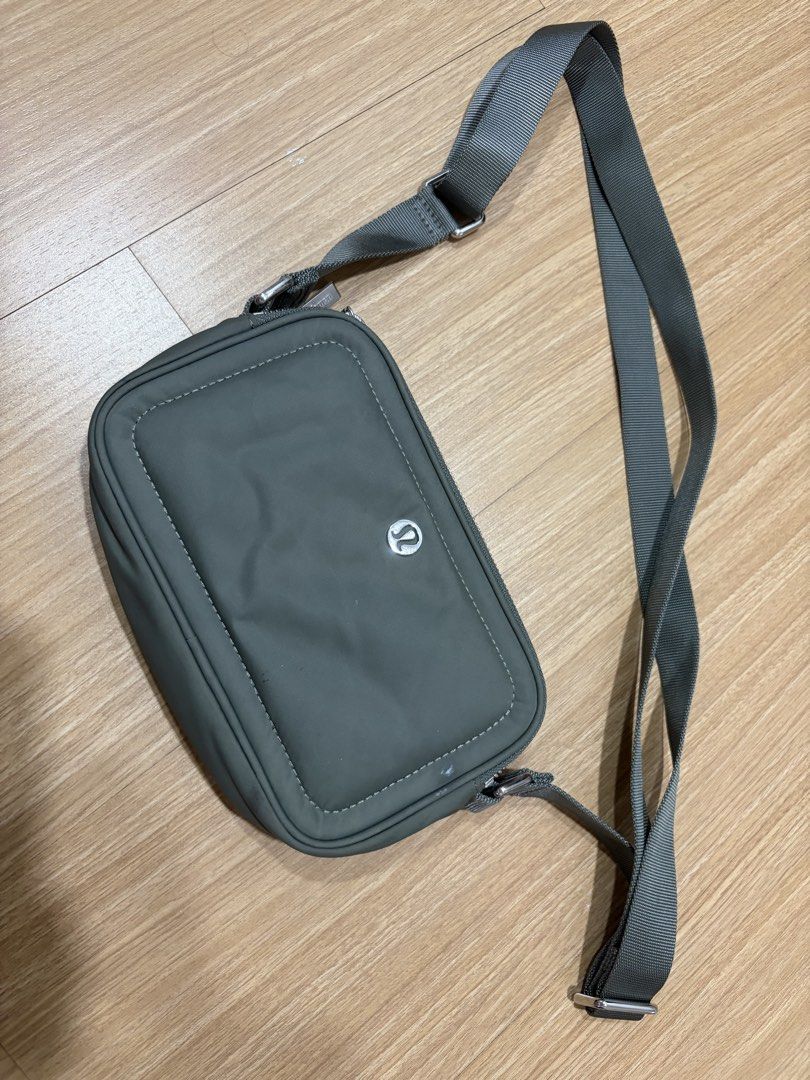 Lululemon Crossbody Camera Bag Sage Green (Category: Cross-body Bags) located in Makati City. Submitted by citysunset (Listing ID 1466816972, Image 2). Description: - Authentic Lululemon crossbody bag - Color: Versatile grey-green - Durable nylon material, ideal for daily use or travel - Multiple zippered compartments to keep your gear organized - Adjustable strap for shoulder or crossbody wear - Compact size fits phone, keys, and cards - Feature