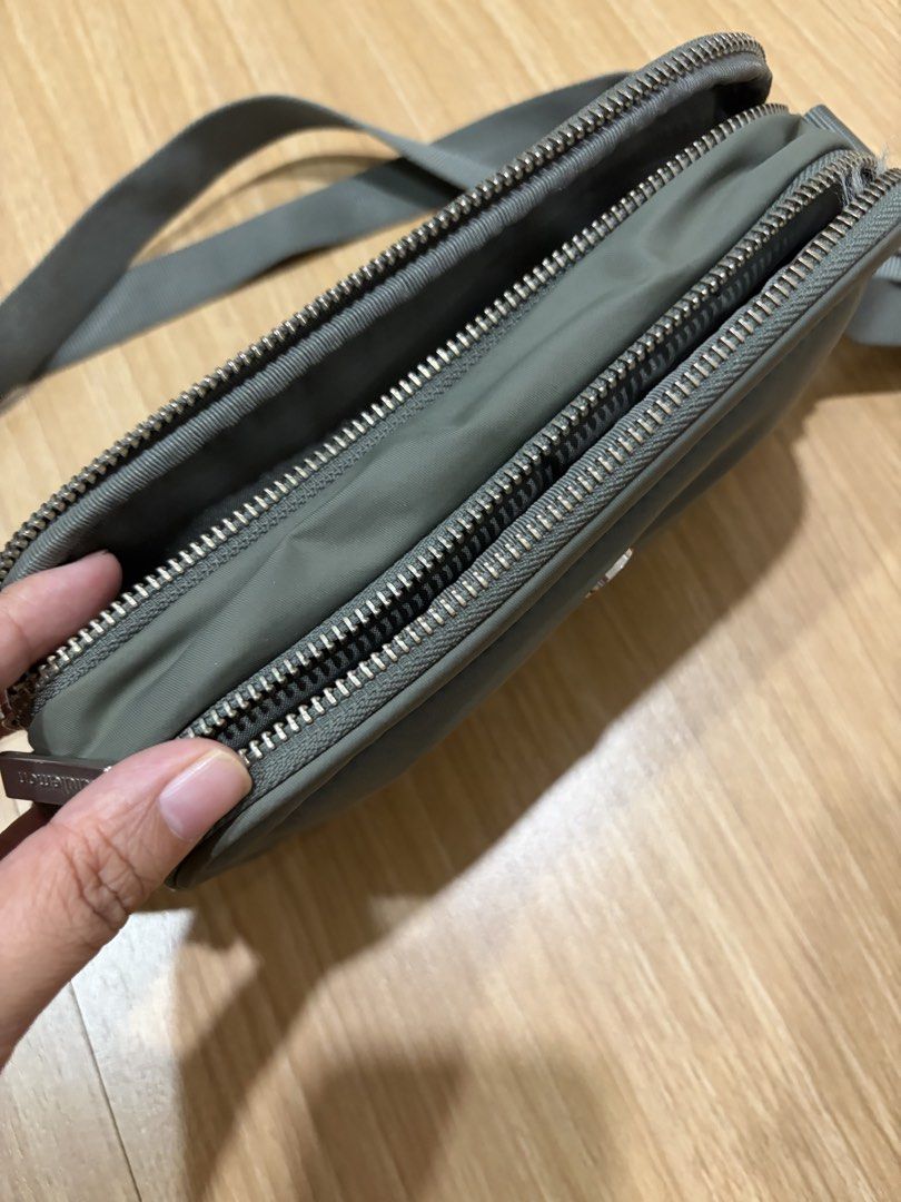 Lululemon Crossbody Camera Bag Sage Green (Category: Cross-body Bags) located in Makati City. Submitted by citysunset (Listing ID 1466816972, Image 3). Description: - Authentic Lululemon crossbody bag - Color: Versatile grey-green - Durable nylon material, ideal for daily use or travel - Multiple zippered compartments to keep your gear organized - Adjustable strap for shoulder or crossbody wear - Compact size fits phone, keys, and cards - Feature