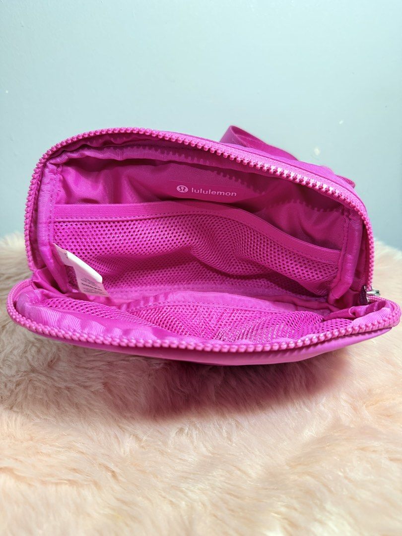 Lululemon Everywhere Belt Bag Dark Magenta (Category: Cross-body Bags) located in Quezon City. Submitted by shaberbree (Listing ID 1466907600, Image 2). Description: - Brand: Lululemon - Color: Dark Magenta / Vibrant Pink - Storage: Main zippered compartment, secure back zip pocket, and interior mesh slip pockets - Fit: Adjustable strap with easy buckle closure - Perfect for daily errands, workouts, and travel.