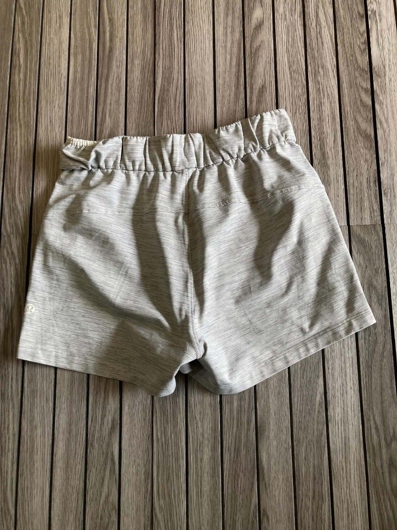 Lululemon Grey Striped Athletic Shorts Size 2 (Category: Shorts) located in Trece Martires City. Submitted by djaothriftshop (Listing ID 1466847870, Image 2). Description: waist 26-30" length 12" hem 11" - Brand: Lululemon - Size: 2 - Color: Grey and white stripes - Features: Elastic waistband, adjustable drawstring with metal aglets, and side pockets - Details: Signature omega logo on lower left leg - Condition: Great lightweight shorts with min