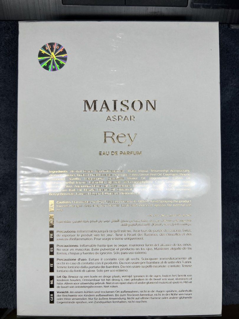 Maison Asrar Rey Eau de Parfum 100ml (Category: Fragrance & Deodorants) located in Manila. Submitted by l4ncedeleon (Listing ID 1466921722, Image 2). Description: - Brand: Maison Asrar (Rey) - Volume: 100ml / 3.4 fl. oz. - Condition: Brand new, factory-sealed in plastic with authentic holographic sticker - Packaging: White box with luxurious gold foil lettering and metallic lion emblem - Origin: Made in United Arab Emirates by Gulf Orchid Perfume
