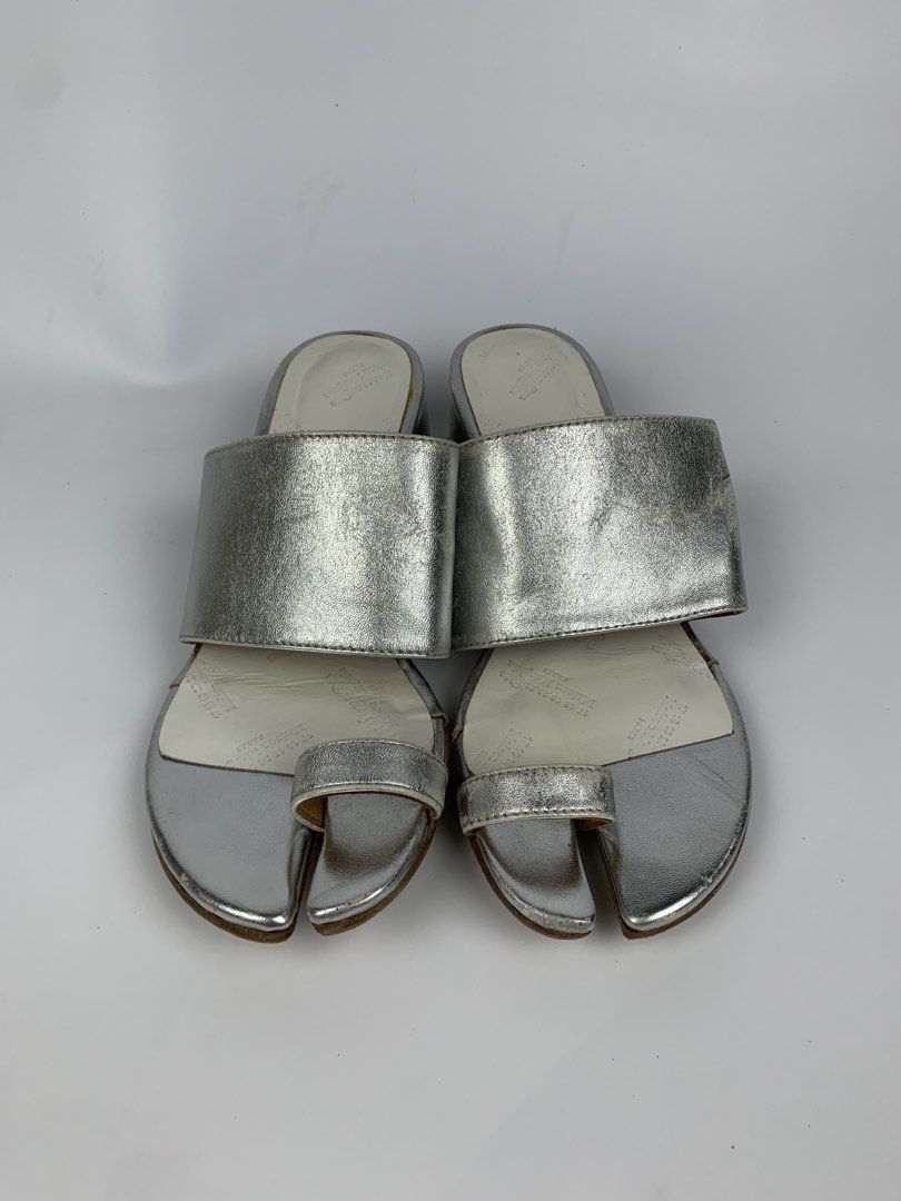 Maison Margiela - Metallic Leather Tabi Toe-ring Mule (Category: Sneakers & Footwear) located in Bacolod City. Submitted by heldatelier_ (Listing ID 1466810584, Image 2). Description: •Verygood Condition •Authentic •Tagged: 35 |22CM Heel height: 1.5” •Flaw: Signs of wear on the metallic area ( It Adds Character to the item ) THIERRY MUGLER JEAN PAUL GAULTIER JPG HELMUT LANG ALEXANDER MCQUEEN CAROL CHRISTIAN POELL KIKO KOSTADINOV DOLCE & GABBANA D