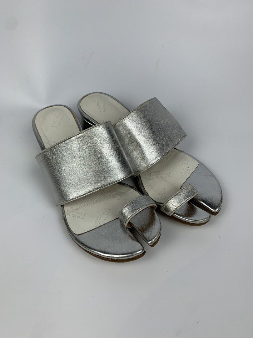 Maison Margiela - Metallic Leather Tabi Toe-ring Mule (Category: Sneakers & Footwear) located in Bacolod City. Submitted by heldatelier_ (Listing ID 1466810584, Image 1). Description: •Verygood Condition •Authentic •Tagged: 35 |22CM Heel height: 1.5” •Flaw: Signs of wear on the metallic area ( It Adds Character to the item ) THIERRY MUGLER JEAN PAUL GAULTIER JPG HELMUT LANG ALEXANDER MCQUEEN CAROL CHRISTIAN POELL KIKO KOSTADINOV DOLCE & GABBANA D