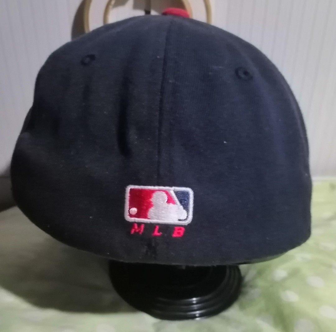 Major League Baseball Boston Red Sox Flexfit Hat (Category: Caps & Hats) located in Quezon City. Submitted by rolenalma (Listing ID 1466928234, Image 3). Description: - Authentic Boston Red Sox cap by Major League Baseball - Stylish navy blue crown with contrasting red brim and top button - Embroidered team logo on front, side patch, and MLB logo on back - Unique stitched 'Red Sox' script lettering under the brim - Comfortable Flexfit elastic ban