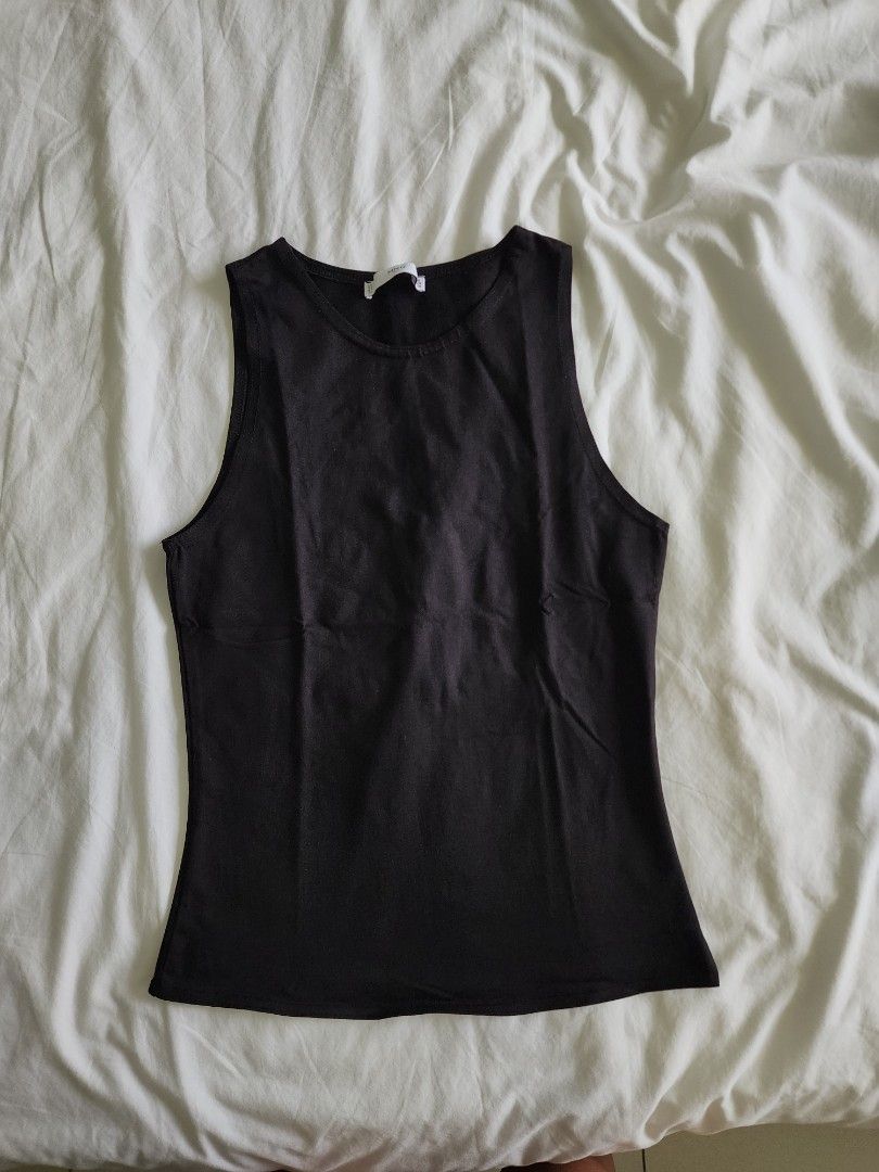Mango Black Racer Tank Top (Category: Sleeveless) located in Cebu City. Submitted by groovefunknsoul (Listing ID 1466864031, Image 1). Description: - Brand: MNG Suit - Size: EUR S / USA XS - Color: Black - Style: Crew neck basic tank top - Features: Stretchy, comfortable fabric, perfect for layering - Condition: Good, ready to wear.