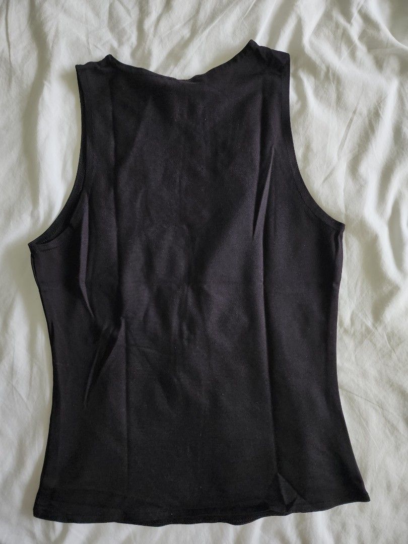 Mango Black Racer Tank Top (Category: Sleeveless) located in Cebu City. Submitted by groovefunknsoul (Listing ID 1466864031, Image 3). Description: - Brand: MNG Suit - Size: EUR S / USA XS - Color: Black - Style: Crew neck basic tank top - Features: Stretchy, comfortable fabric, perfect for layering - Condition: Good, ready to wear.