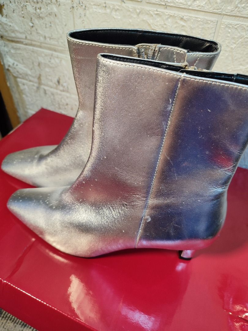 Marks and Spencer Metallic Silver Boots Size UK 6 (Category: Boots) located in Caloocan City. Submitted by jel_gielle (Listing ID 1466934391, Image 2). Description: - Brand: Marks & Spencer - Style: Metallic silver kitten heel ankle boots with square toe and side zippers - Size: UK 5 / EUR 38 - Condition: Brand new with tags attached (Original Price: PHP 4,950) - Material: Non-leather, 100% vegan friendly - Country of Origin: Made in Cambodia.