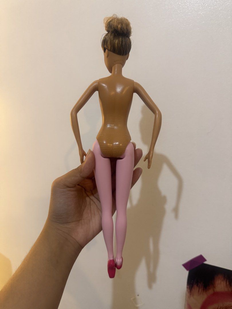 Mattel Barbie Ballerina Doll (Category: Kids Toys) located in Manila. Submitted by cococlio (Listing ID 1466872202, Image 2). Description: - Authentic 2015 Mattel Ballerina Doll - Features lovely brown skin tone and brown hair in a classic bun - Molded pink tights and attached pink toe shoes - Movable arms and legs for various dance poses - Product code DVG16 marked on the back - Great addition to any doll collection.