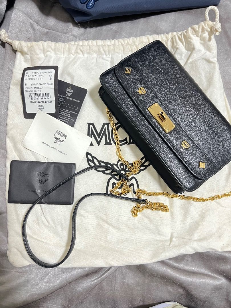 MCM Original Sling Wallet Bag with Card Compartment (Category: Luxury Bags & Wallets) located in Caloocan City. Submitted by ggeorgecastro (Listing ID 1466794930, Image 1). Description: Well used, you can see that in the photo. You can used it as clutch bag. .