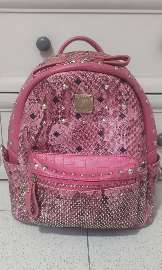 MCM Studded Pink Backpack Medium (Category: Backpacks) located in Pasig City. Submitted by xcess_baggage (Listing ID 1466884480, Image 1). Description: flaws shown in photos..