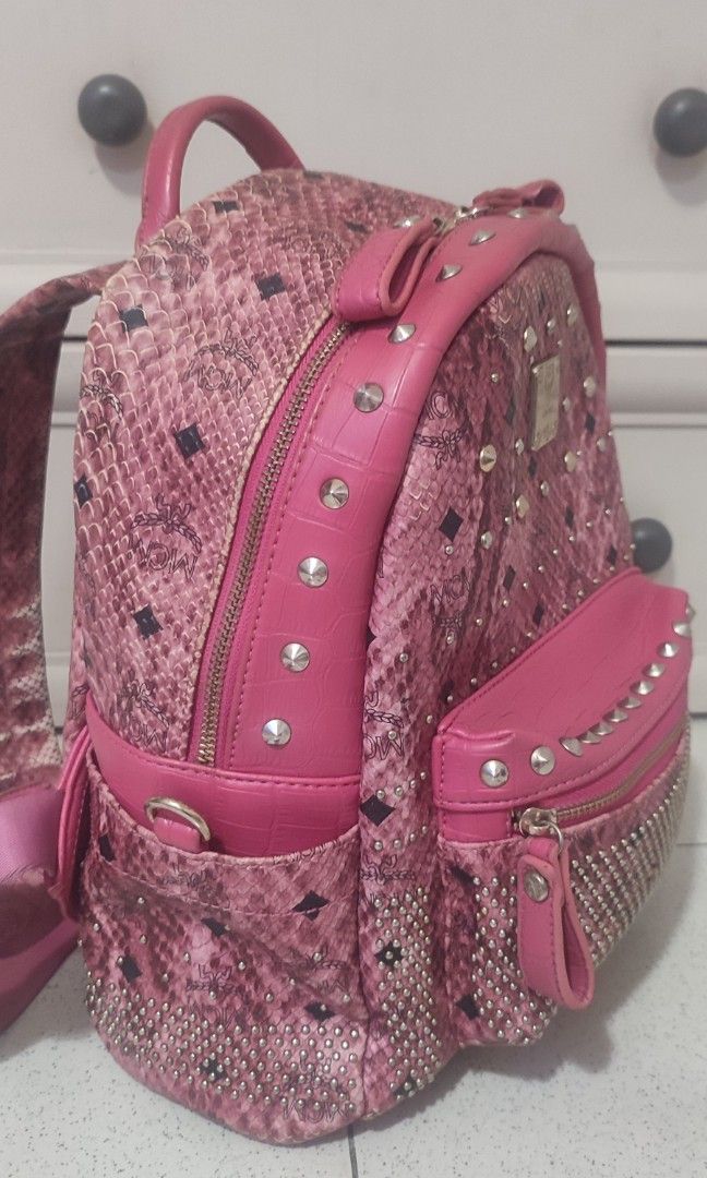MCM Studded Pink Backpack Medium (Category: Backpacks) located in Pasig City. Submitted by xcess_baggage (Listing ID 1466884480, Image 2). Description: flaws shown in photos..