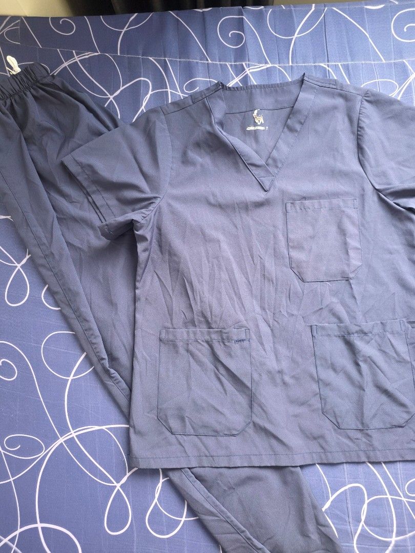 medical scrubs set top and pants (Category: Sets or Coordinates) located in Taguig. Submitted by min3rvaaaa (Listing ID 1466815021, Image 1). Description: - Color: Dark blue - Top: V-neck with 3 convenient front pockets - Pants: Elastic waistband with white drawstring closure - Material: Soft, durable, and easy-to-wash fabric - Ideal for: Nurses, doctors, and healthcare professionals - Used it for almost 2 months only (internship) ✅️ Price: 350 e
