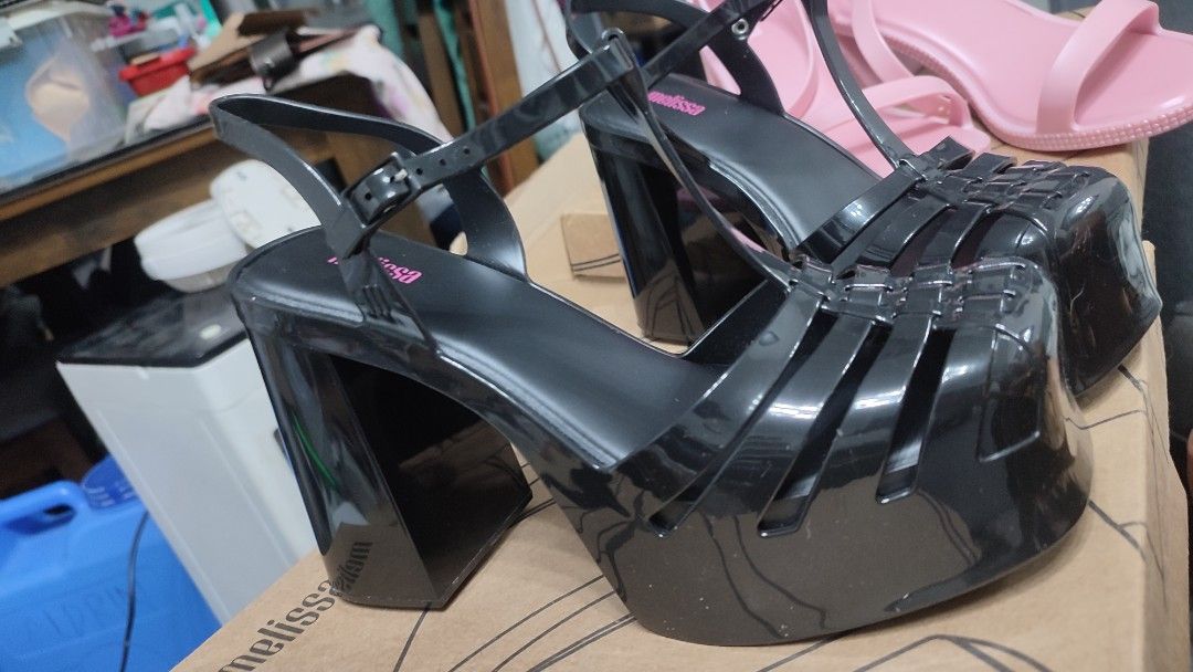 Melissa Jelly Platform Heels Black (Category: Heels) located in Muntinlupa City. Submitted by calmdeer.658cb4_gem (Listing ID 1466774750, Image 1). Description: - Black platform heels with caged design and chunky block heel - Great statement shoes for any occasion - Check photos for detailed condition - brand new, unworn - slight issue in the back -with box -6k+ orig price in website.
