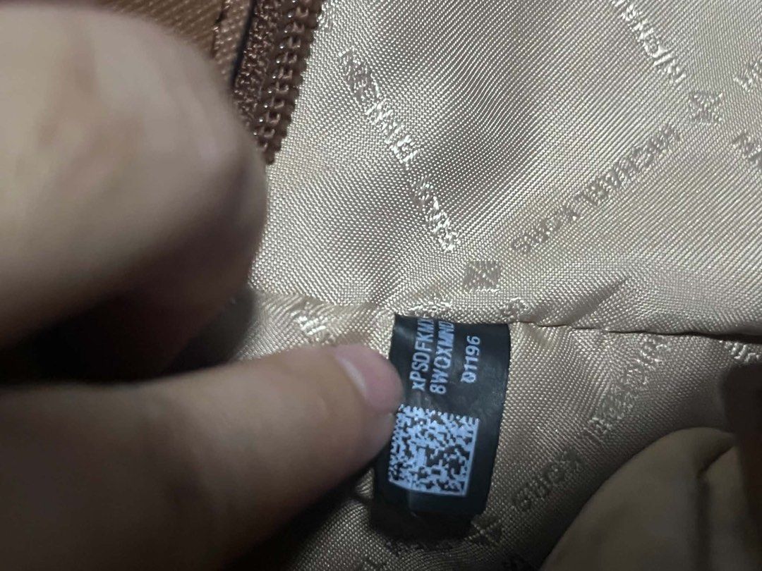 Michael Kors Brown Monogram Tote Bag (Category: Luxury Bags & Wallets) located in Manila. Submitted by angelclair65992 (Listing ID 1466830013, Image 3). Description: Authentic Michael Kors bag with care card! 🤎 Decluttering! 👜🤎 Michael Kors Tote Bag for sale! Spacious and classy pa rin. May peeling na sa coating due to use, kaya selling at a budget-friendly price. 📩 Message me for the price and more details! .
