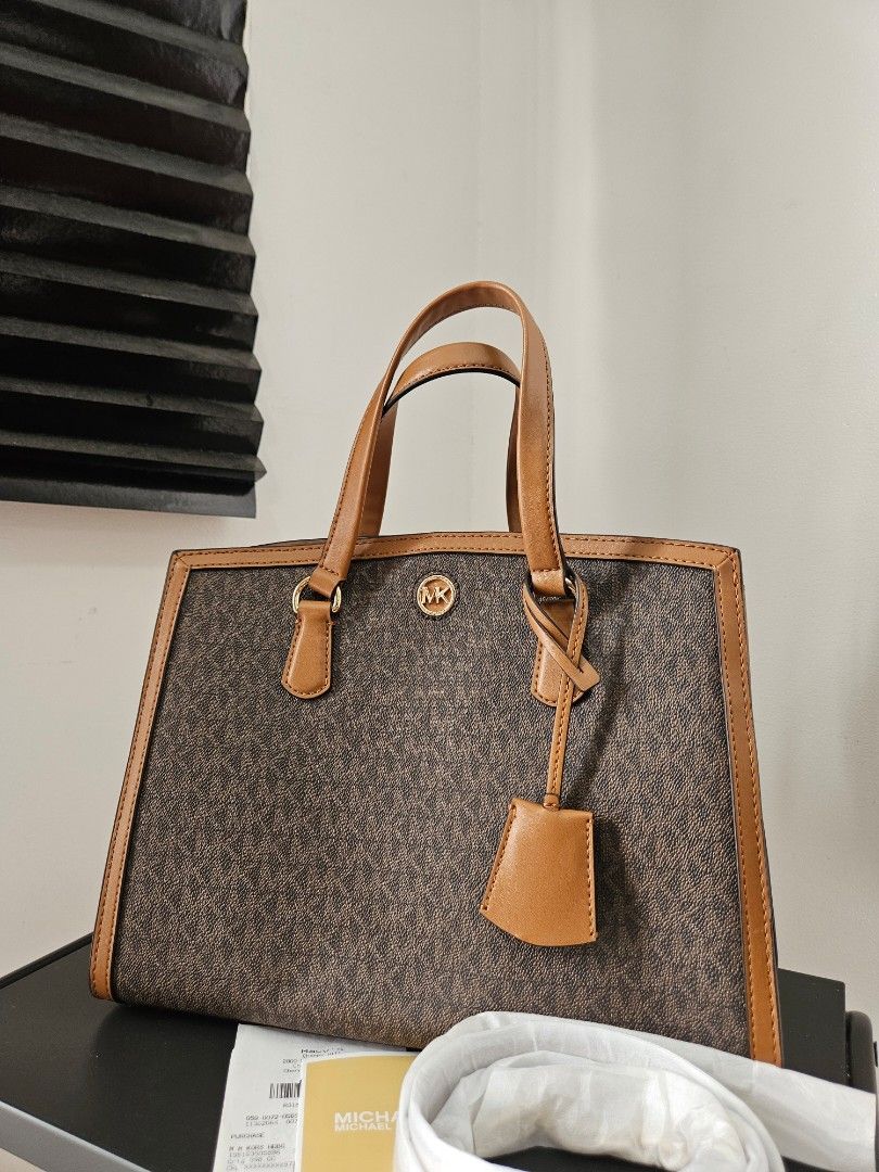 Michael Kors Chantal Medium Logo Satchel Brown (Category: Luxury Bags & Wallets) located in Quezon City. Submitted by angelafrancescarasos (Listing ID 1466921779, Image 2). Description: - Brand: Michael Kors - Style: Chantal Medium Logo Satchel - Color: Brown - Inclusion: Long strap and original receipt included - Note: Dustbag and paperbag are NOT included.