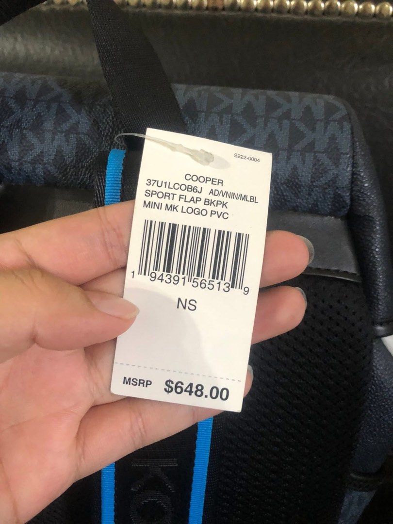 Michael Kors Cooper Sport Flap Backpack Blue (Category: Backpacks) located in Magalang. Submitted by jamiealdana1 (Listing ID 1466903035, Image 3). Description: - 100% Authentic Michael Kors Cooper Sport flap backpack - Blue mini MK logo PVC with a striking blue stripe design - Secure flap closure with buckle hardware and front zip pocket - Adjustable shoulder straps featuring signature Michael Kors lettering - Protective paper wraps still intact