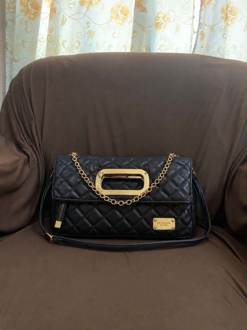 Michael Kors Kili/ Sling Bag (Category: Shoulder Bags) located in Dagupan City. Submitted by maryennie (Listing ID 1466847236, Image 1). Description: Working zippers (all) Spacious interior Structured design Suitable for work, daily use or travel -Condition: Pre-loved, with visible signs of use such surface scratches/scuffs and some wear on the gold hardware. Please refer to photos for exact condition. ⭐️Selling as-is. Please inspect photos caref