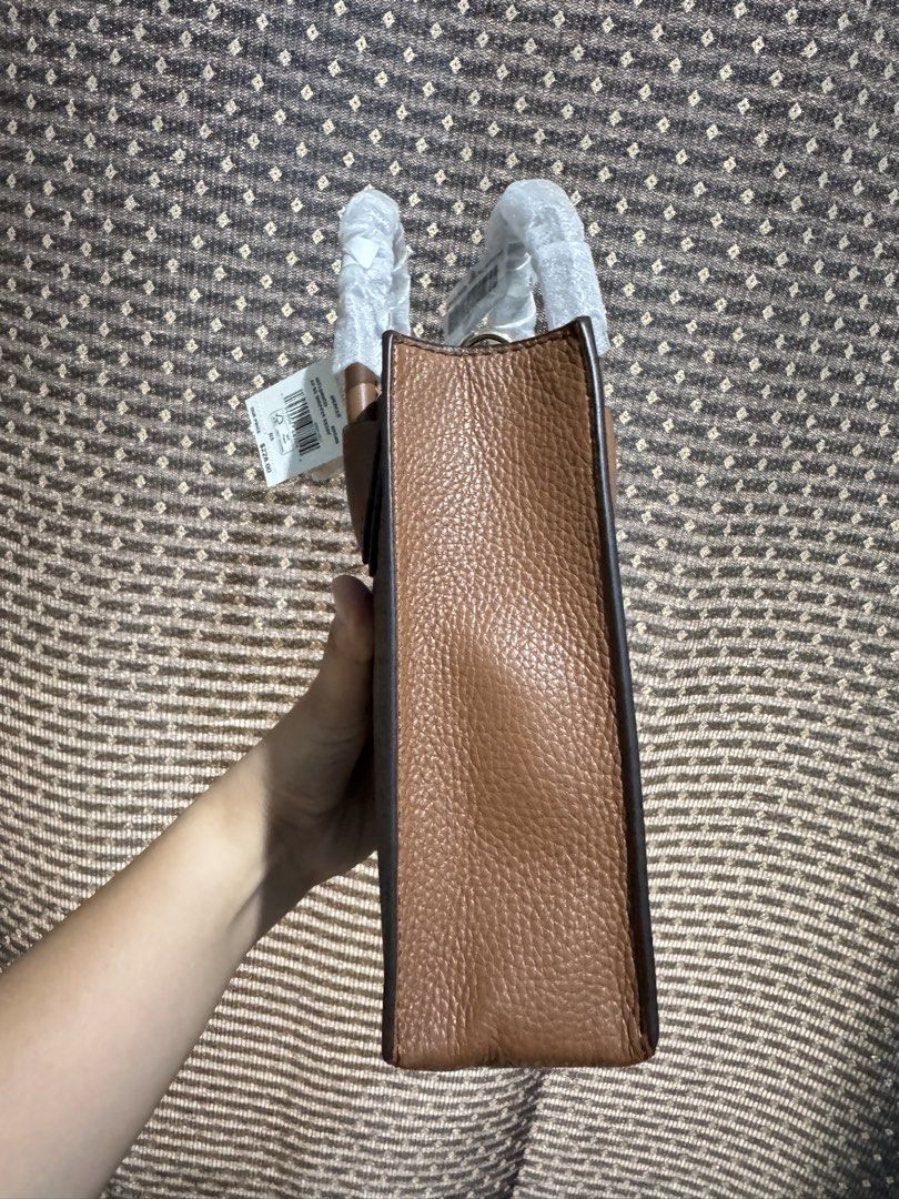 Michael Kors Mercer Extra Small Bag (Category: Cross-body Bags) located in Bulacan. Submitted by cheeryfatima (Listing ID 1466923246, Image 3). Description: FOR SALE: Michael Kors Mercer Extra-Small Crossbody Bag 🤎 • Color: Brown Signature Logo • Style: 35T1GM9C0I • Brand-new • Unused, with original tags and packaging • Includes adjustable long strap • Compact, classy, and perfect for everyday use Please note: The bag does not have the snap clos