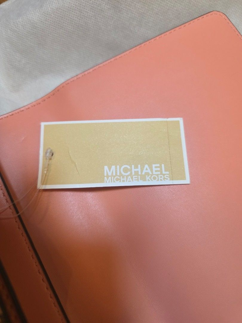 Michael Kors Mott Peach Multi Embossed Leather Shoulder Bag (Category: Shoulder Bags) located in Iligan City. Submitted by ilovechocolatecakes (Listing ID 1466784681, Image 3). Description: - Brand: Michael Kors - Style: Mott Shoulder Bag - Color: Peach Multi with smooth peach leather flap - Material: Snake-embossed and smooth leather - Hardware: Gold-tone hardware and chain strap - Features: Interior zip pocket for organization - Condition: Bran