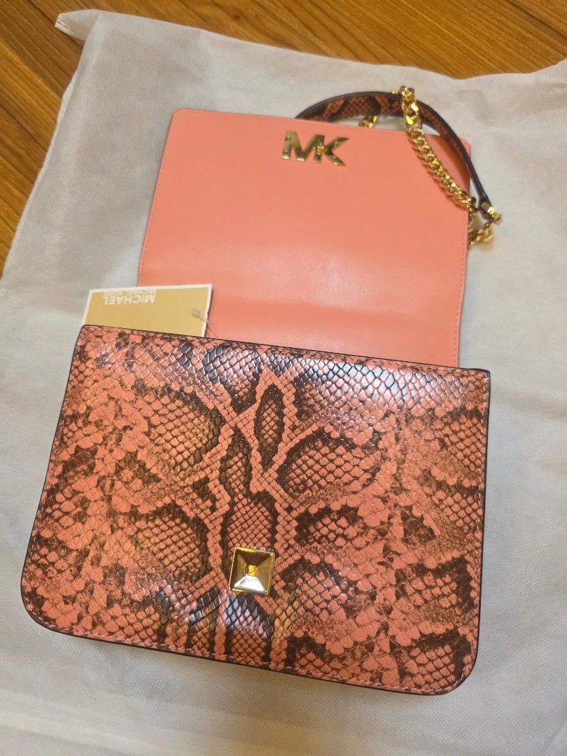 Michael Kors Mott Peach Multi Embossed Leather Shoulder Bag (Category: Shoulder Bags) located in Iligan City. Submitted by ilovechocolatecakes (Listing ID 1466784681, Image 1). Description: - Brand: Michael Kors - Style: Mott Shoulder Bag - Color: Peach Multi with smooth peach leather flap - Material: Snake-embossed and smooth leather - Hardware: Gold-tone hardware and chain strap - Features: Interior zip pocket for organization - Condition: Bran