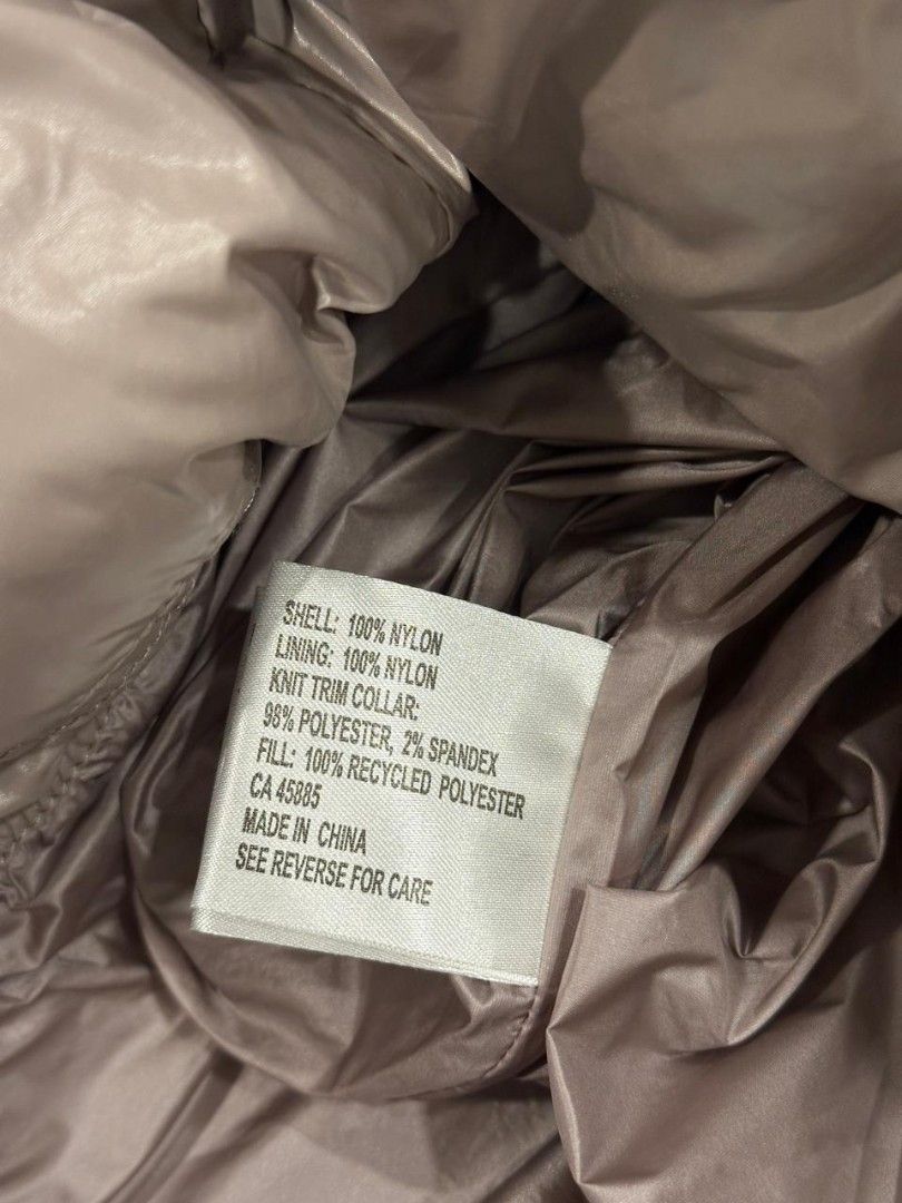 Michael Kors Puffer Jacket (Category: Coats, Jackets and Outerwear) located in Muntinlupa City. Submitted by aremvy (Listing ID 1466783926, Image 3). Description: Preloved Authentic Michael Kors Puffer Jacket - Size: M - Color: Glossy Taupe - Features: Full zip front, zippered side pockets, oversized gathered hood, and signature MK metal sleeve logo Water-resistant and wind-proof. .