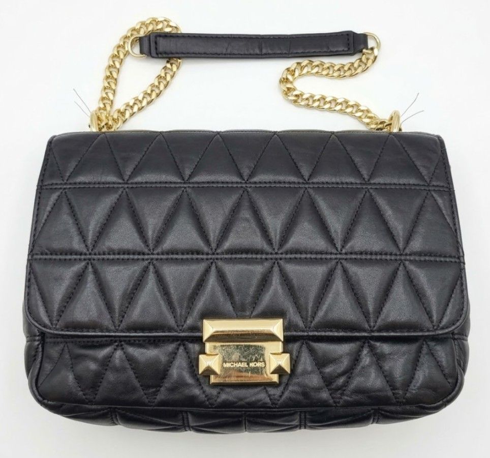 Michael Kors Sloan Black Quilted Bag (Category: Cross-body Bags) located in Imus. Submitted by cheratedfinds (Listing ID 1466965547, Image 1). Description: Michael Kors Sloan Quilted Flap Bag Factory Tag: Displays the official style code 30S7GSLL3L, production season F19 (Fall 2019), factory code SA-1905 ₱2,200 | Pre-loved ​Striking flap shoulder bag featuring geometric triangle quilting, gold-tone chain hardware, and a push-lock closure. ​Condit