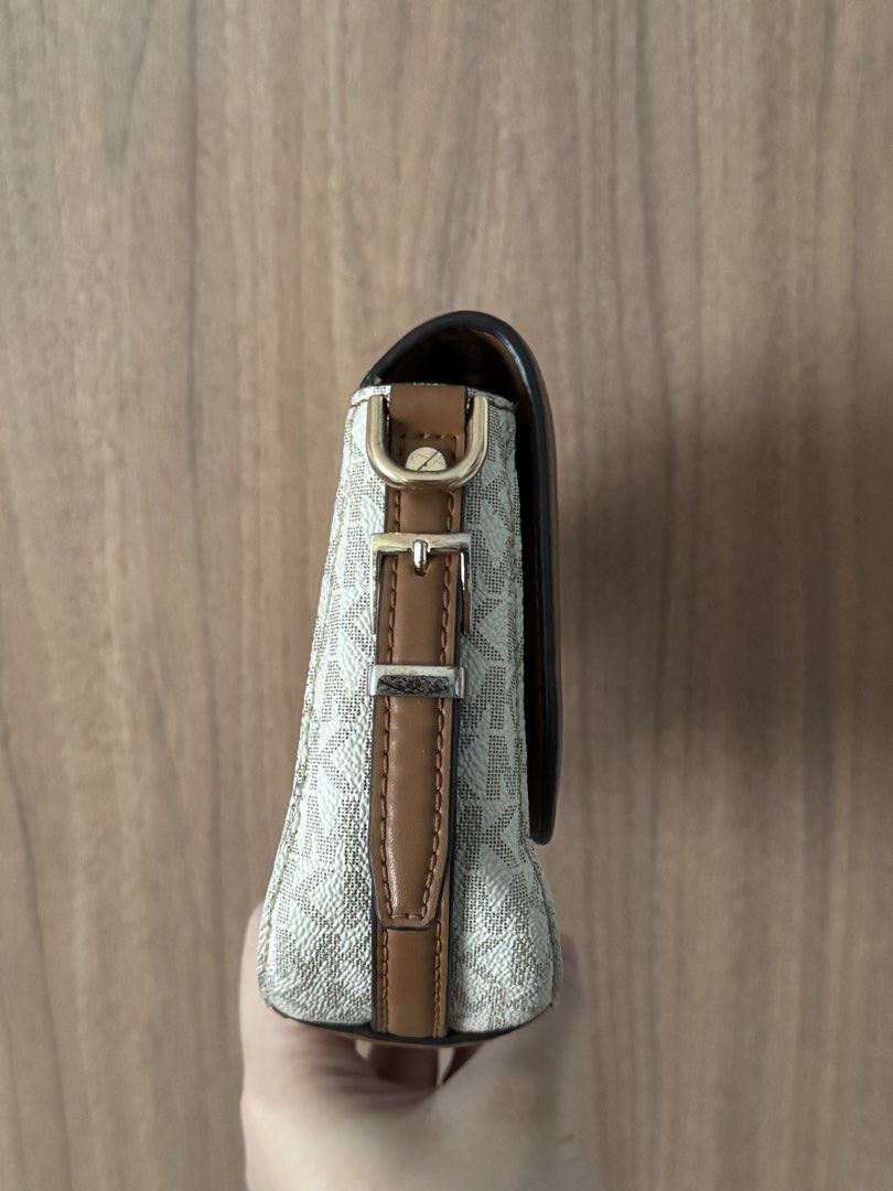 Michael Kors Two-Tone Saddle Bag (Category: Luxury Bags & Wallets) located in Bacoor. Submitted by nicafindssince2022 (Listing ID 1466803274, Image 3). Description: - Authentic Michael Kors saddle bag - Secure flap closure with magnetic snap - Compact and lightweight, ideal for daily essentials - Clean interior, well-maintained condition - Versatile design matches both casual and dressy outfits.