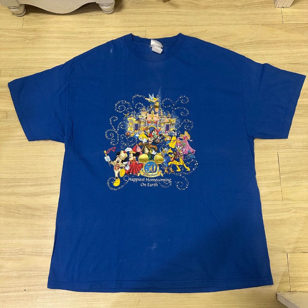 Mickey disneyland (Category: Tshirts & Polo Shirts ) located in Caloocan City. Submitted by pablow.escobart (Listing ID 1466921681, Image 1). Description: Blue Disney Parks 50th anniversary t-shirt. Happiest Homecoming On Earth graphic on the front with castle, Mickey, and friends. Small gold Mickey ears 50th logo printed on the back near the neckline. Short sleeves, crew neck style, comfortable cotton fabric..