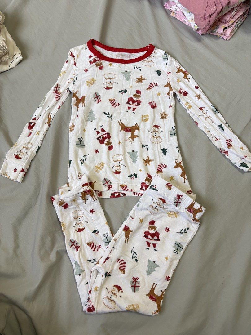 Milkberry Christmas Pyjamas Set 24M (Category: Babies & Kids Fashion) located in Quezon City. Submitted by sailormooooo (Listing ID 1466921036, Image 1). Description: - Brand: Milkberry - Size: 24M (Toddler) - Design: Festive holiday print with Santa, reindeer, snowmen, and Christmas trees - Features: Long sleeves, long pants, contrasting red collar and cuffs, and tag-free comfort - Material: Soft and cozy, ideal for holiday lounging and bedtime.
