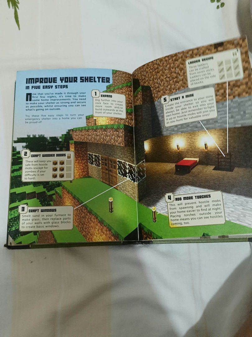 Minecraft Beginner's Handbook Official Guide Mojang Hardcover (Category: Children's Books) located in Paranaque City. Submitted by krishagon11581 (Listing ID 1466929145, Image 3). Description: - Official Mojang Minecraft Beginner's Handbook (Hardcover) - Stylish green faux-leather cover with gold foil pickaxe design and embossed lettering - Essential guide for early edition gameplay mechanics, crafting recipes, and survival tips - Condition: Show