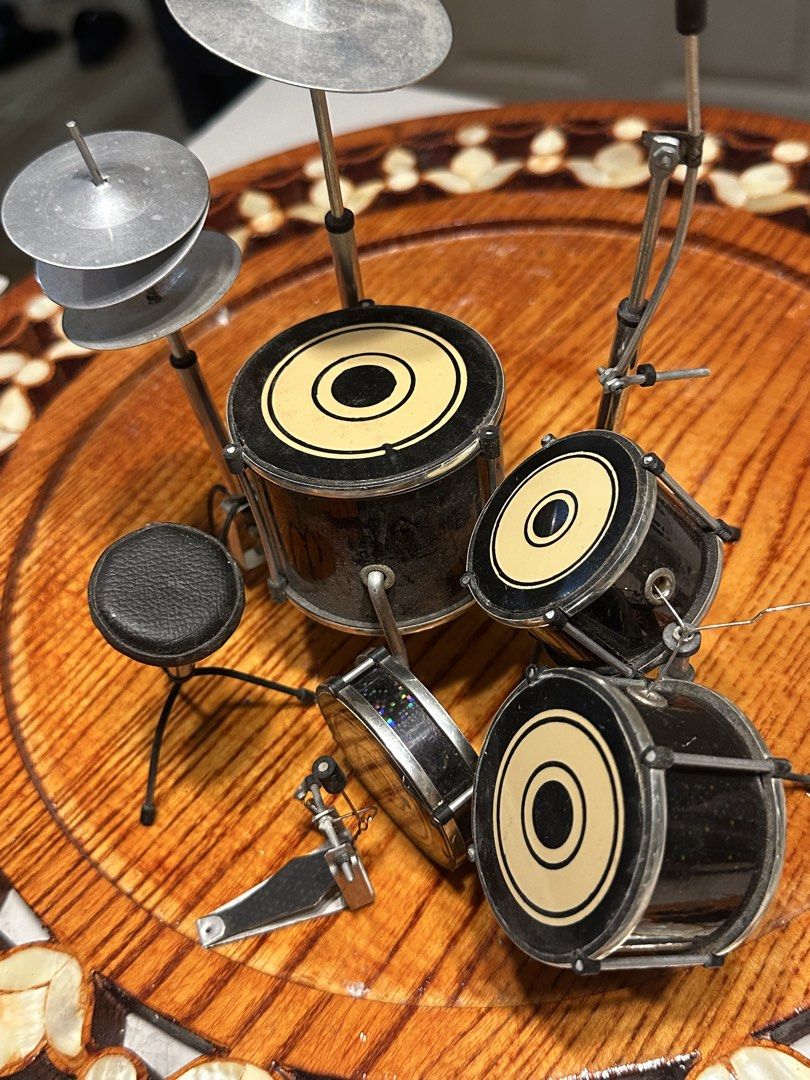 Miniature Drum Set Model (Category: Musical Instruments) located in Manila. Submitted by tenshiii185 (Listing ID 1466916052, Image 2). Description: - Complete miniature drum kit replica with stylish black and cream drumheads - Includes bass drum, floor tom, snare, rack tom, cymbals, -hat, stool, and foot pedal - Features detailed metal hardware and stands throughout - Compact size makes it ideal for desk decor - Great gift or display piece for mu