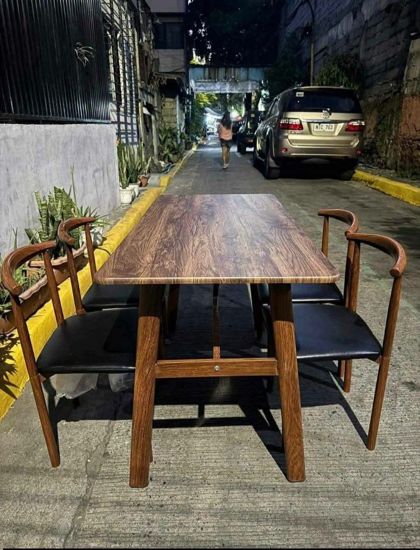 Minimalist Dining Table with 4 Chairs Wood Finish (Category: Tables & Sets) located in Caloocan City. Submitted by swiftflower_802790 (Listing ID 1466948259, Image 3). Description: - Complete set: 1 compact rectangular wooden dining table and 4 matching chairs - Comfortable: Cushioned seats with dark upholstery and supportive curved backrests - Versatile: Neutral tones that easily blend with any kitchen or dining room decor - Durable: Built with 