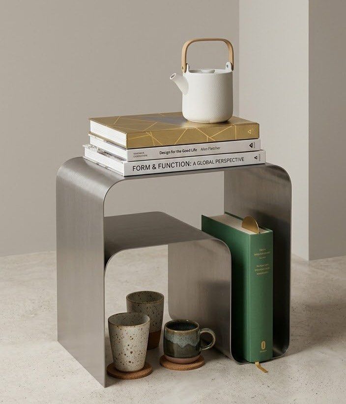Minimalist Stainless Steel Nested Side Table Modern Design (Category: Tables & Sets) located in Mandaluyong City. Submitted by justinb2007 (Listing ID 1466853113, Image 1). Description: price 9K LP this is brand new stainless steel location mandaluyong - Sleek stainless steel side table with a minimalist curved design - Built-in nested shelf provides extra storage and display space - Clean brushed metallic finish suits modern, industrial, or cont