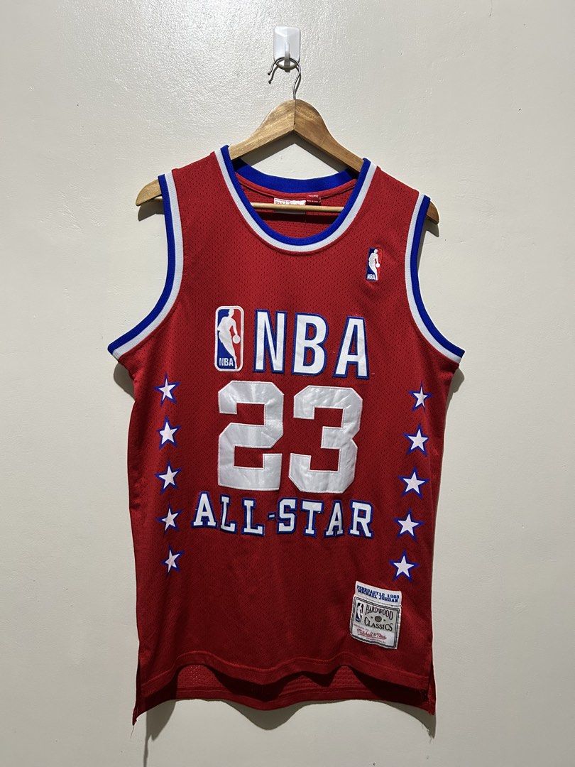 Mitchell & Ness Michael Jordan 1989 All-Star Jersey (Category: Activewear) located in Angeles City. Submitted by johngamboa (Listing ID 1466961936, Image 1). Description: - Brand: Mitchell & Ness Hardwood Classics - Edition: 1989 NBA All-Star - Player: Michael Jordan (#23 on front and back) - Color: Vibrant red with white and blue trim - Details: Embroidered stars down both sides, NBA logo patch on upper chest - Ideal for: Collectors and casual s