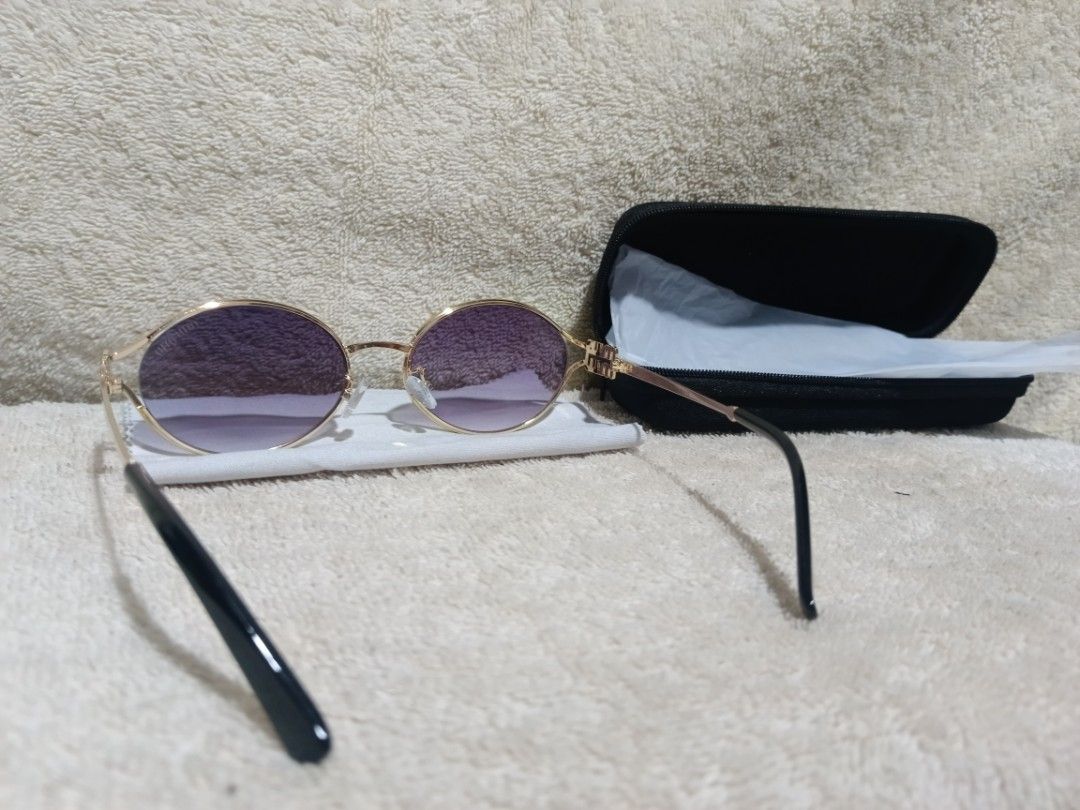 Miu Miu Gold Frame Gradient Purple Sunglasses with Case (Category: Sunglasses & Eyewear) located in Cavite. Submitted by navias (Listing ID 1466799447, Image 2). Description: Origin:UAE - Brand: Miu Miu - Style: Gold metal frames with gradient purple lenses - Details: Distinct Miu Miu logo hardware on temples and standard nose pads - Condition: Clean frames and unblemished lenses - Inclusions: Black hard shell carrying case and microfiber cleanin