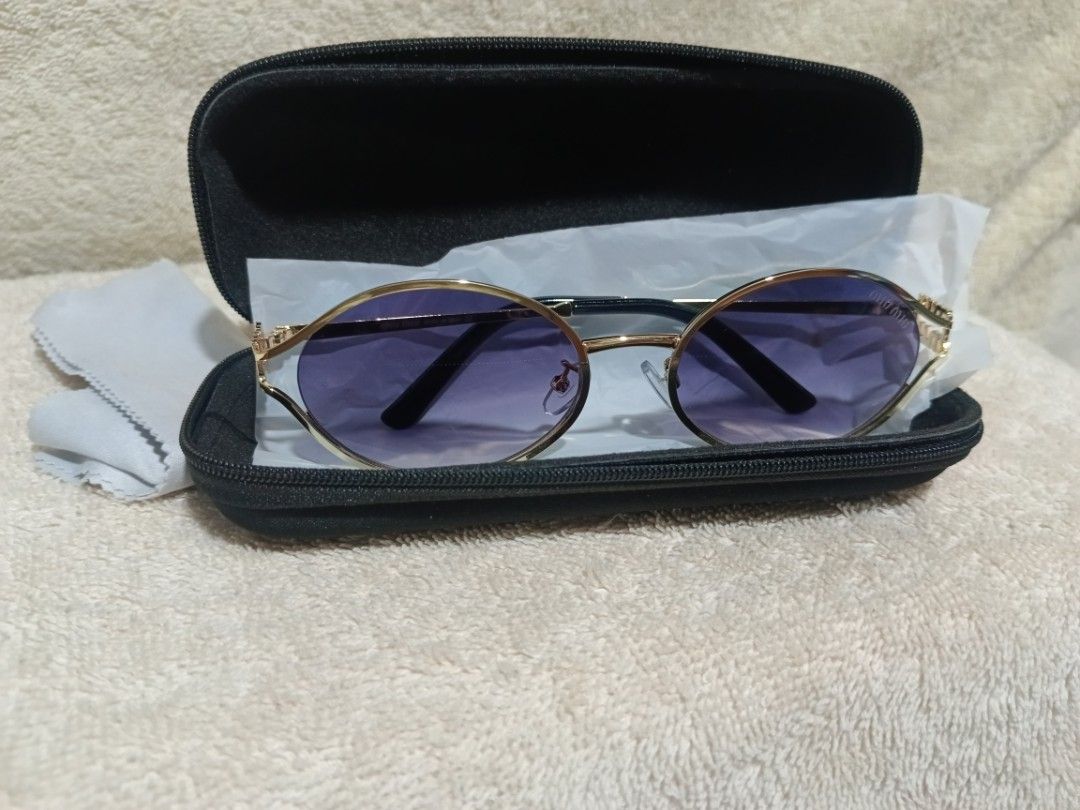 Miu Miu Gold Frame Gradient Purple Sunglasses with Case (Category: Sunglasses & Eyewear) located in Cavite. Submitted by navias (Listing ID 1466799447, Image 3). Description: Origin:UAE - Brand: Miu Miu - Style: Gold metal frames with gradient purple lenses - Details: Distinct Miu Miu logo hardware on temples and standard nose pads - Condition: Clean frames and unblemished lenses - Inclusions: Black hard shell carrying case and microfiber cleanin