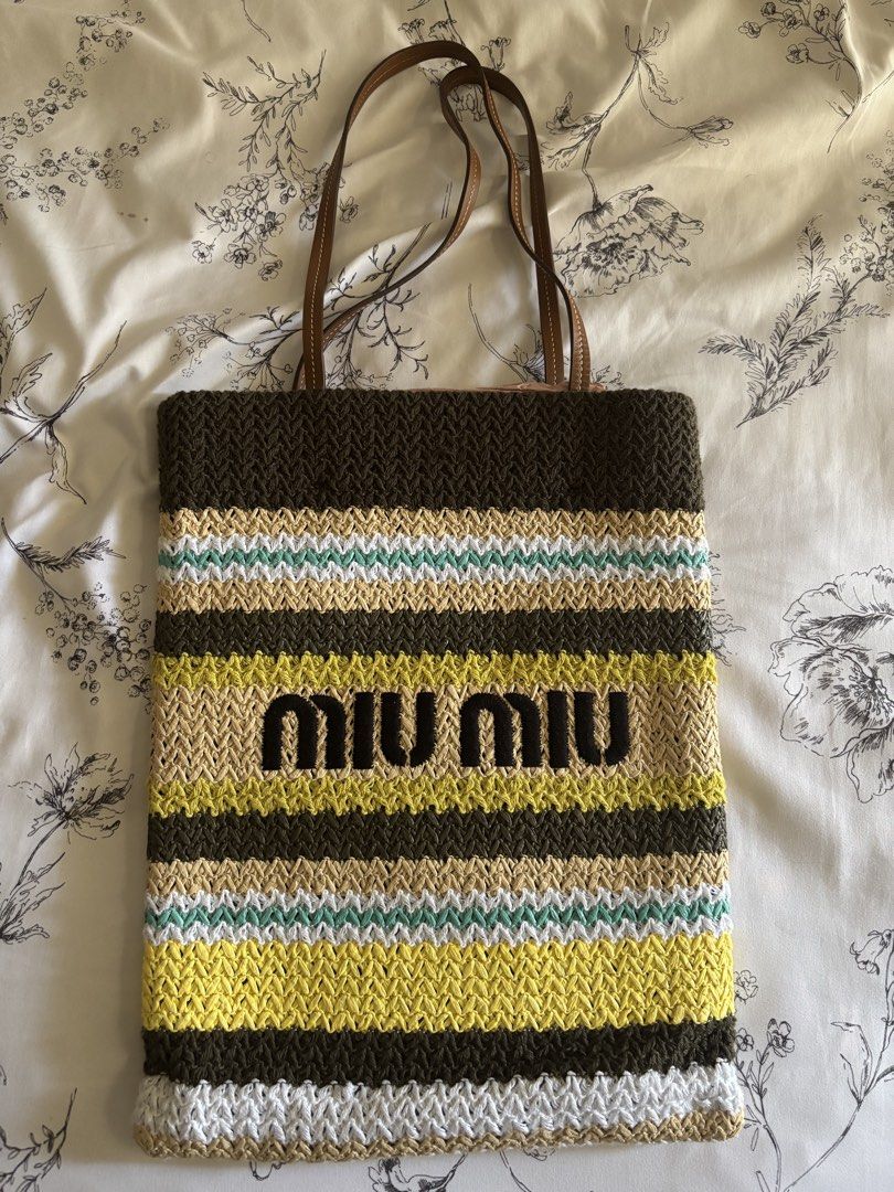 Miu Miu Raffia Effect Tote Bag (Category: Tote Bags) located in Muntinlupa City. Submitted by fierce.chazzy (Listing ID 1466823077, Image 1). Description: Selling this bag for a fair price! Message me for more details. Inclusion: With box and dust bag ✨.