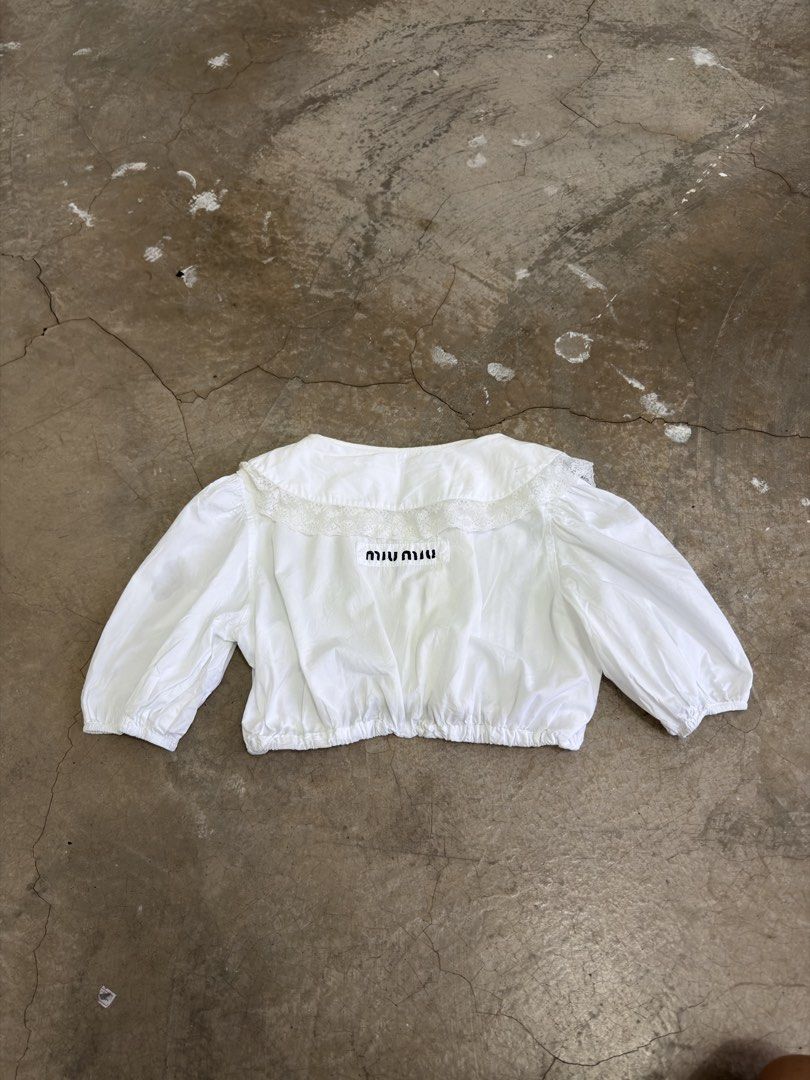 Miu Miu White Cotton Lace top (Category: Luxury Apparel) located in Alfonso. Submitted by jbcamet (Listing ID 1466879744, Image 1). Description: - Brand: Miu Miu - Origin: Made in Italy - Size: 36 - Material: 100% Cotton - Details: Delicate lace paneling with elasticated gathering - Care: Cold hand wash inside out - Authenticity: Includes official tag with QR code and NFC chip (RN 98339, CA 34767).