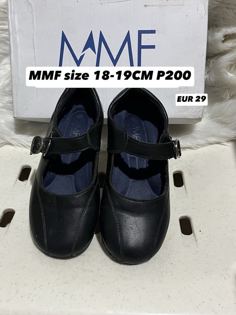 MMF Black School Shoes (Category: Babies & Kids Fashion) located in Quezon City. Submitted by Mhia17 (Listing ID 1466776014, Image 1). Description: - Brand: MMF - Style: Black Mary Jane shoes with rounded toe box and stitched panel details - Size: EUR 29 (best fits 18-19cm feet) - Features: Adjustable strap with metal closure and comfortable blue inner sole lining - Perfect for: Daily school uniform wear - Inclusions: Comes with original white MM
