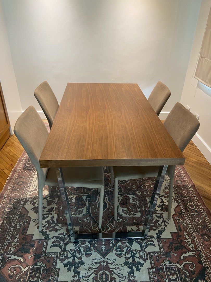 Modern Wooden Dining Table with 4 Chairs (Category: Tables & Sets) located in Manila. Submitted by goldenrabbit_605125 (Listing ID 1466839637, Image 1). Description: - Complete dining set: 1 table and 4 matching chairs - Tabletop: Beautiful wooden surface with a rich grain pattern - Base: Sturdy and modern chrome metal legs - Chairs: 4 comfortable upholstered chairs in a versatile neutral tan fabric .