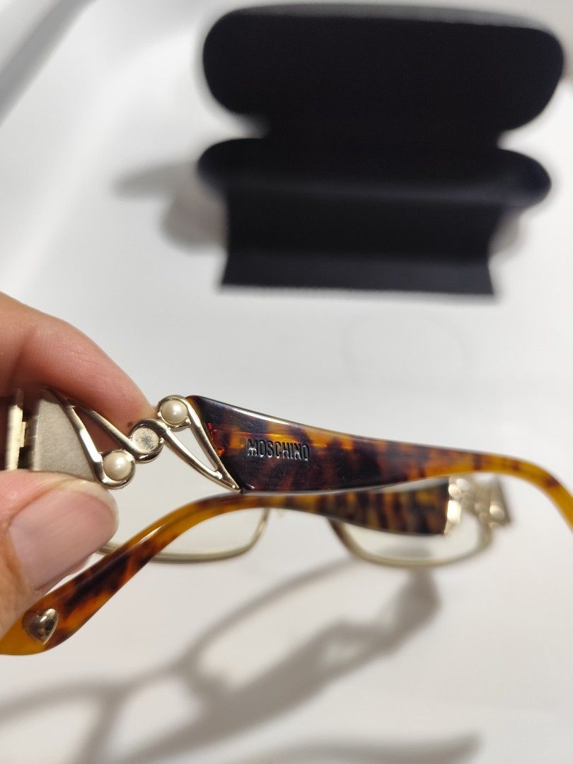 Moschino Frame (Category: Sunglasses & Eyewear) located in Cebu City. Submitted by icoolectnsellect (Listing ID 1466903293, Image 3). Description: Issue: Minor Scratch, Dirt and RX lens, missing 1 nosepad. Bought at Garage Sale. Authenticity not Guaranteed, di ko alam if legit or Fake. Buy @ your own Risk. All EyeGlasses or Sun Glasses ay may Grado or Prescription Glasses. Please be careful para di masira mata nyo, you can change the lens and fra